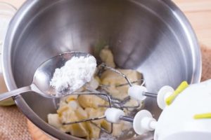 mixing bowl with sugar and butter ingredients for apple crumb muffins