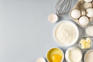 ingredients for glazed apple crumb muffin recipe including eggs, sugar, flour, and butter