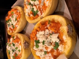 completed buffalo spaghetti squash dish topped with bleu cheese