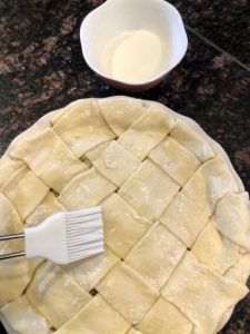 brushing milk on pastry dough